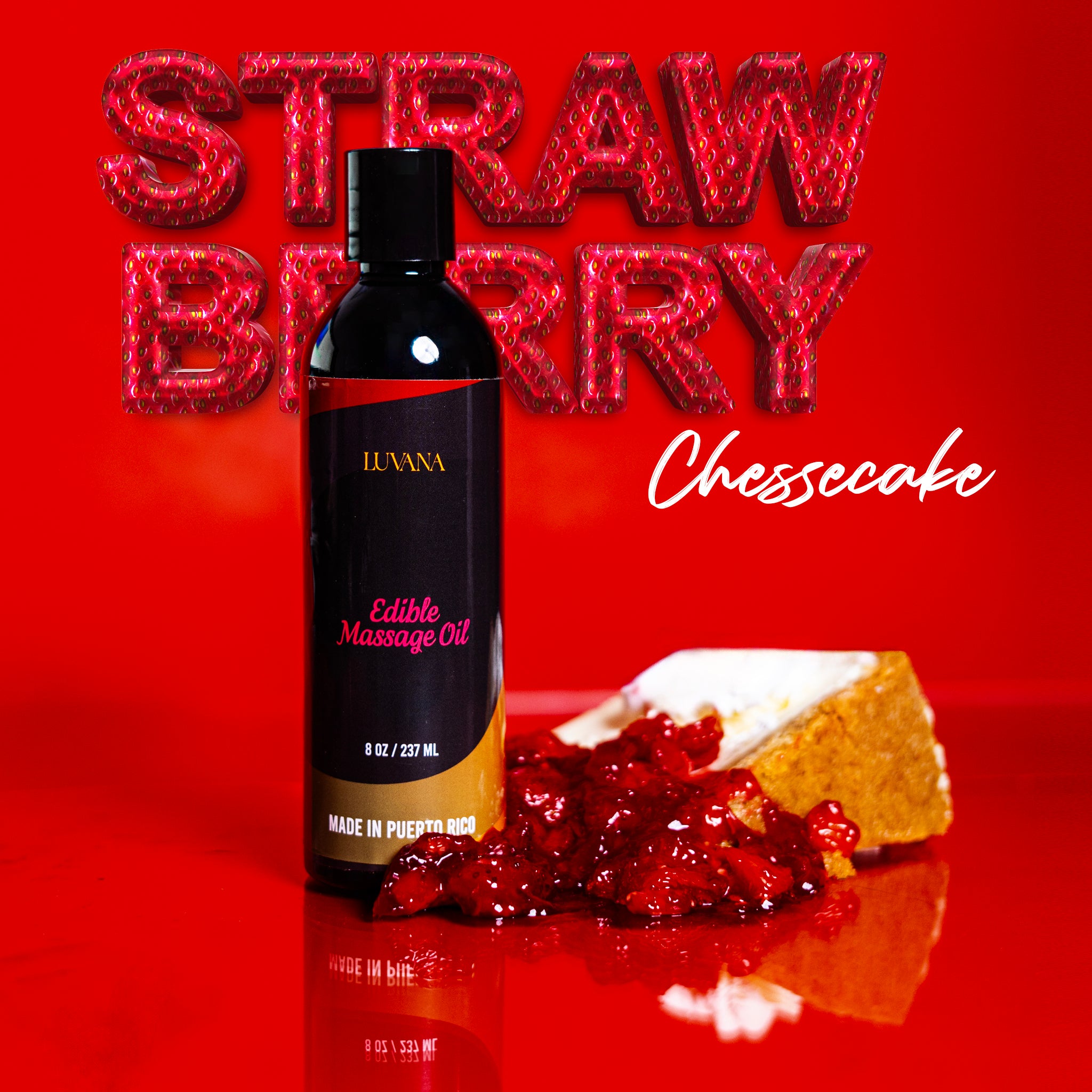 Luvana Edible Massage Oil in Strawberry Cheesecake flavor on a red background with strawberry “STRAWBERRY” text and a slice of cheesecake with berry topping