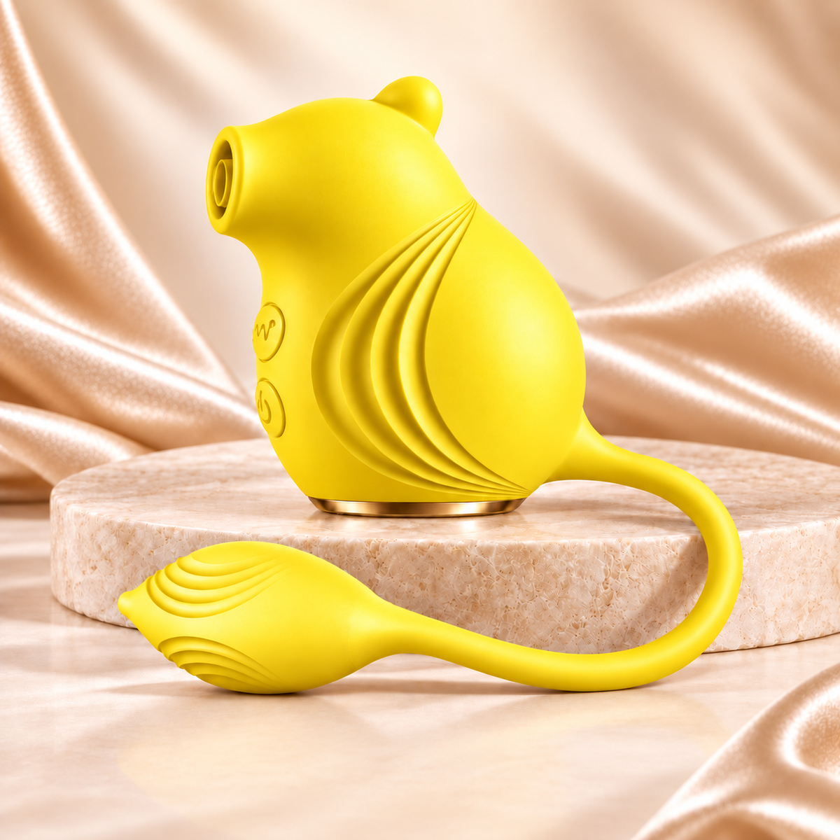 Sassy Squirrel yellow vibrator on champagne satin and stone, without text