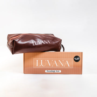 Discreet Luvana storage bag included with 11-piece maroon leather bondage kit