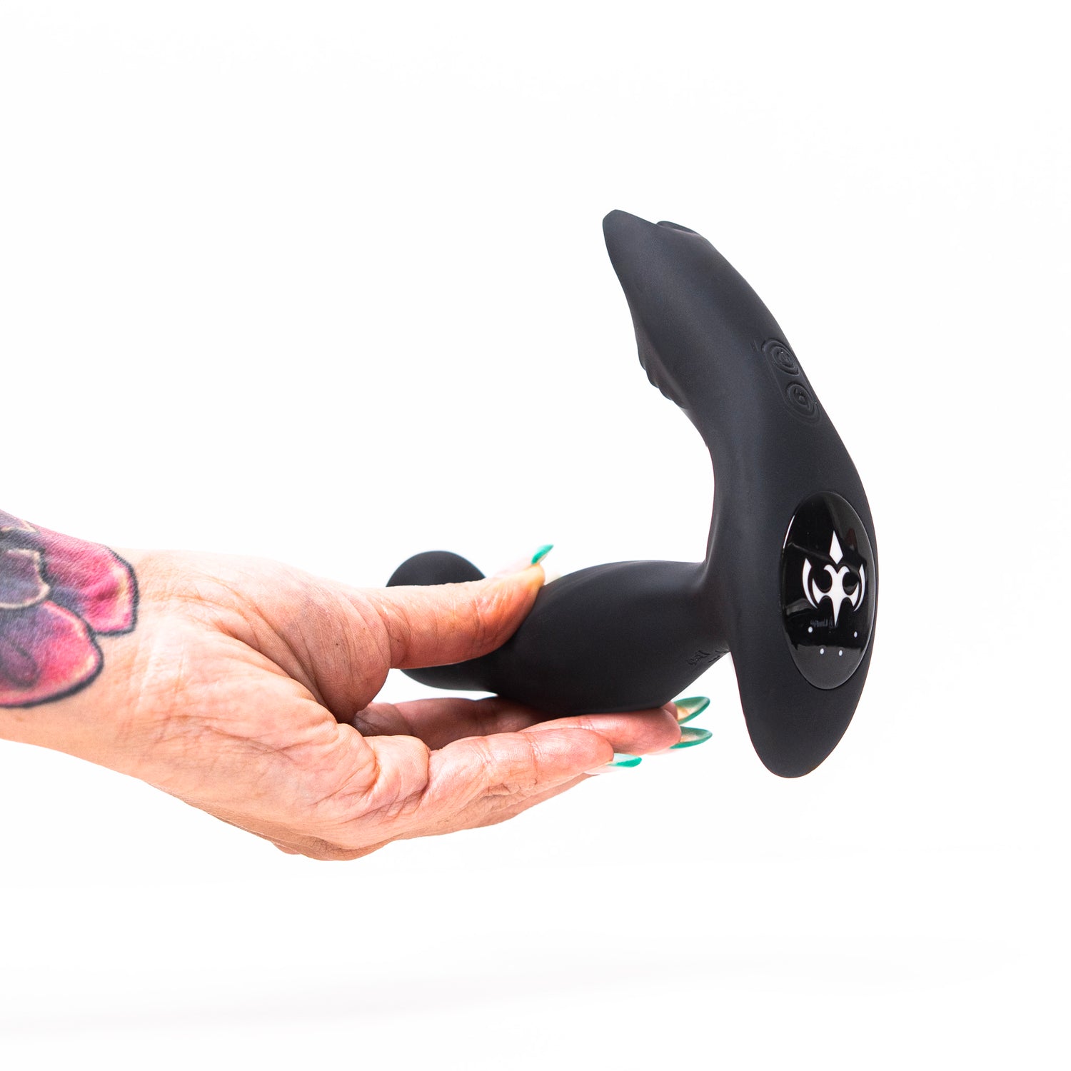 Hand holding the Luvana Knight Ryder prostate massager showing the curved tip and control panel.