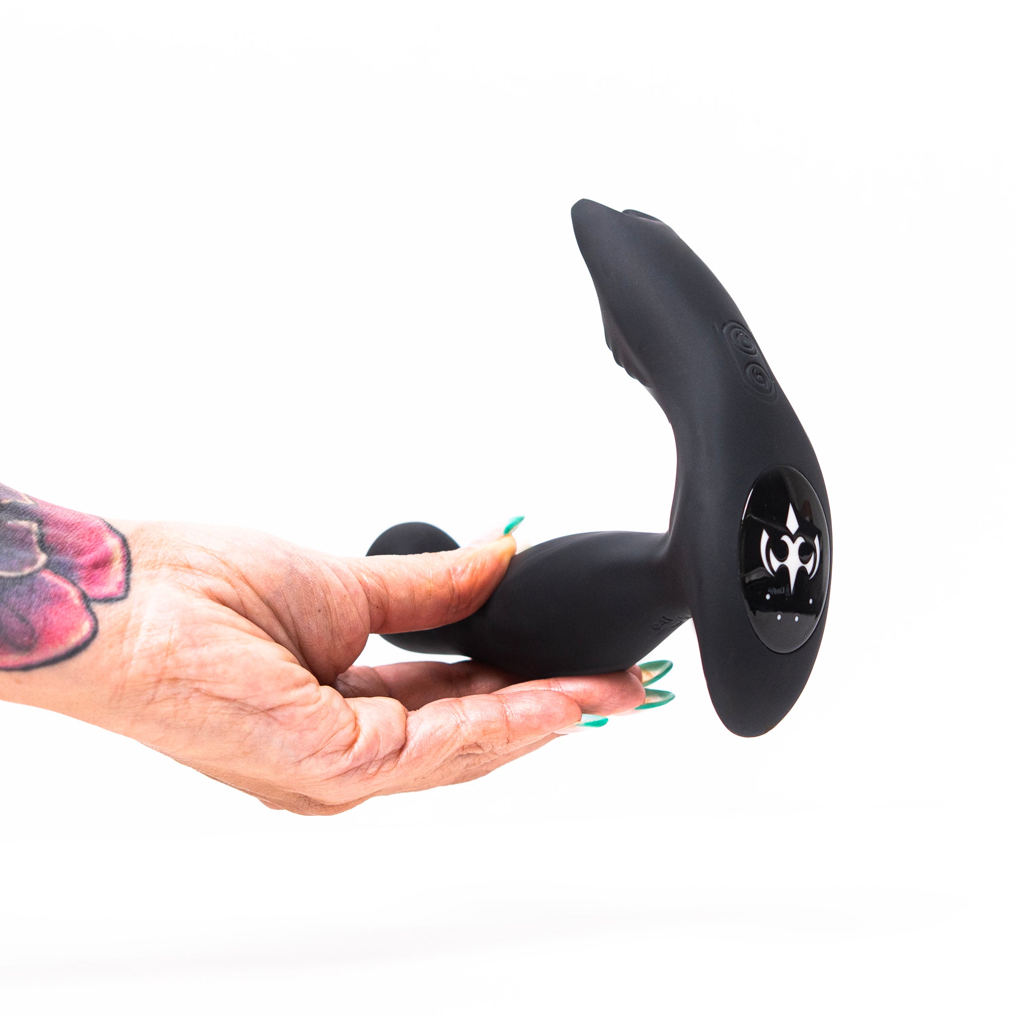Hand holding the Luvana Knight Ryder prostate massager showing the curved tip and control panel.