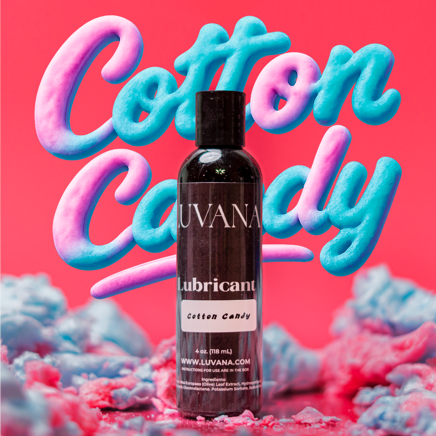 Luvana cotton candy flavored edible water-based lubricant bottle on a pink background with cotton candy clouds, 4 oz (118 mL).