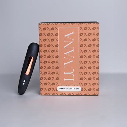 Luvana Mini Bliss discreet bullet vibrator next to Luvana branded gift box with rose-gold details.