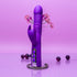 Purple Luvana Thrust Bunny thrusting rabbit vibrator standing upright on pink background, dual stimulation rechargeable sex toy