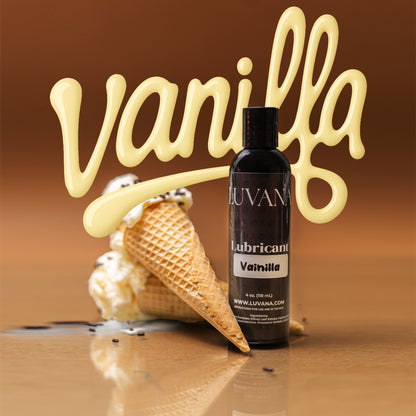 Luvana vanilla flavored edible water-based lubricant bottle on a warm background with vanilla ice cream cone, 4 oz (118 mL).