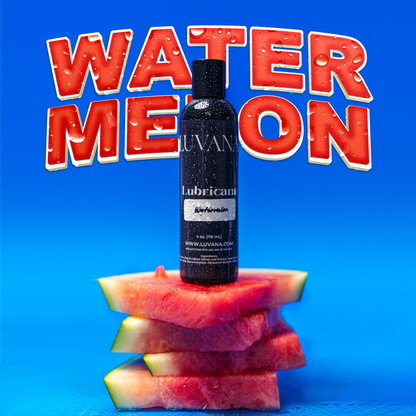 Luvana watermelon flavored edible water-based lubricant bottle on stacked watermelon slices with a blue background, 4 oz (118 mL).